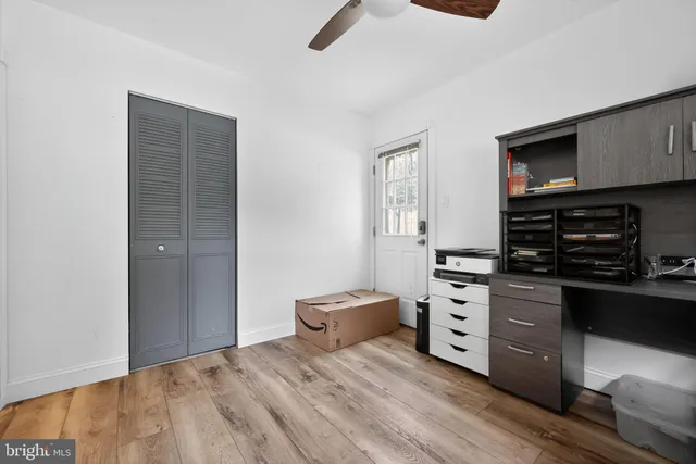 a bedroom with a bed and a television