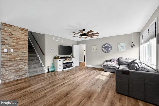 a bedroom with furniture and a flat screen tv