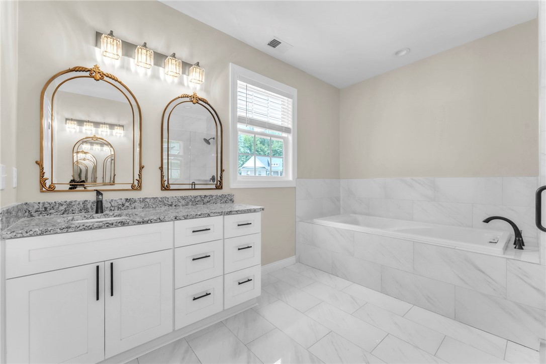 1015 Winmar Drive Anderson, SC 29621 - Photo 26 of 49 Bright and airy bath with dual vanities and a relaxing soaking tub awaits.