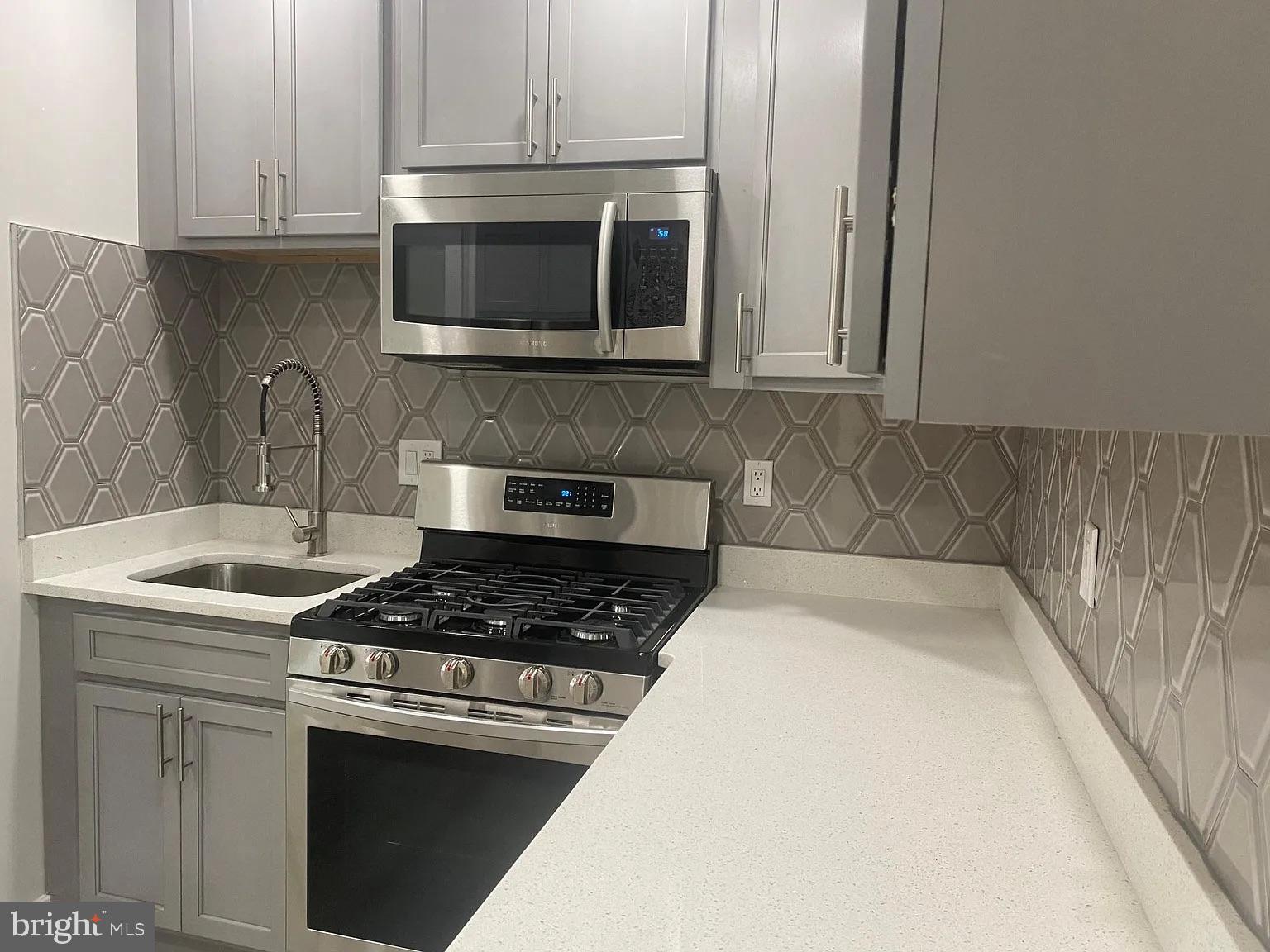 940 5th Street Laurel, MD 20707 - Photo 2 of 10 Sleek kitchen with modern finishes.