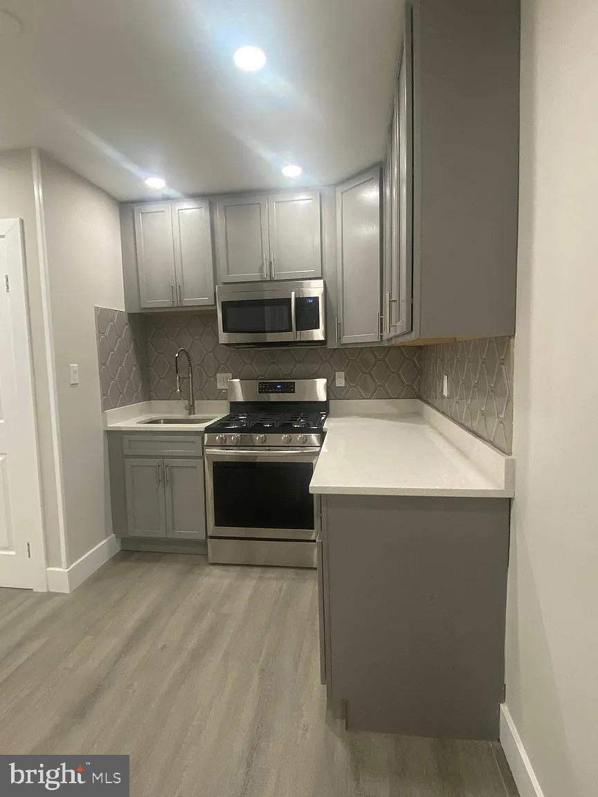 940 5th Street Laurel, MD 20707 - Photo 3 of 10 Sleek modern kitchen with stylish finishes.