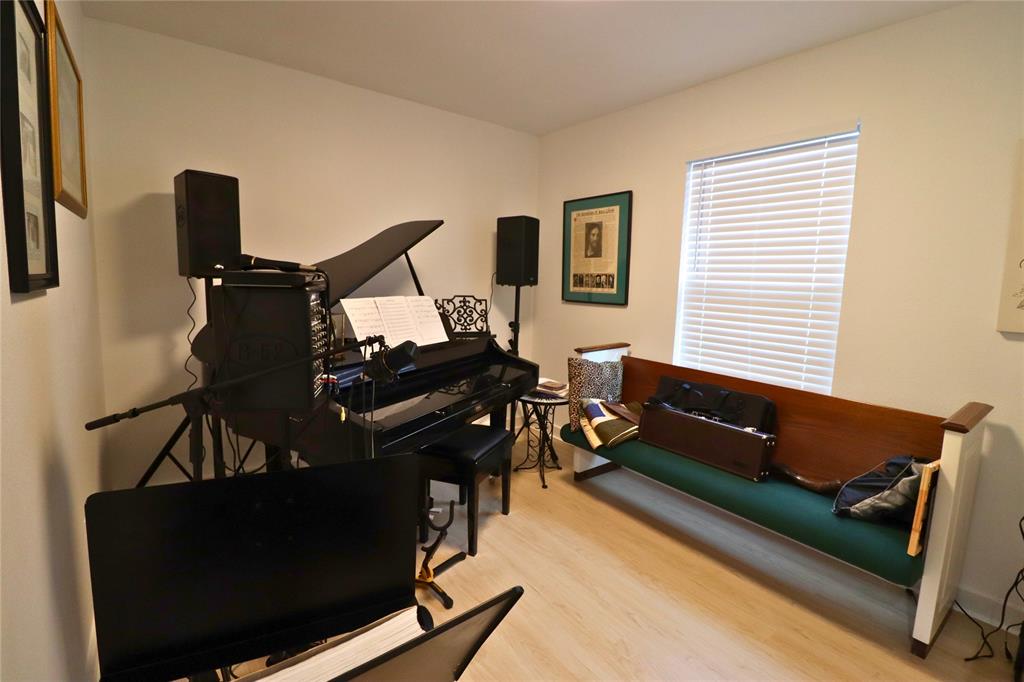 309 Thomas Street Terrell, TX 75160 - Photo 13 of 17 a living room with furniture and a flat screen tv