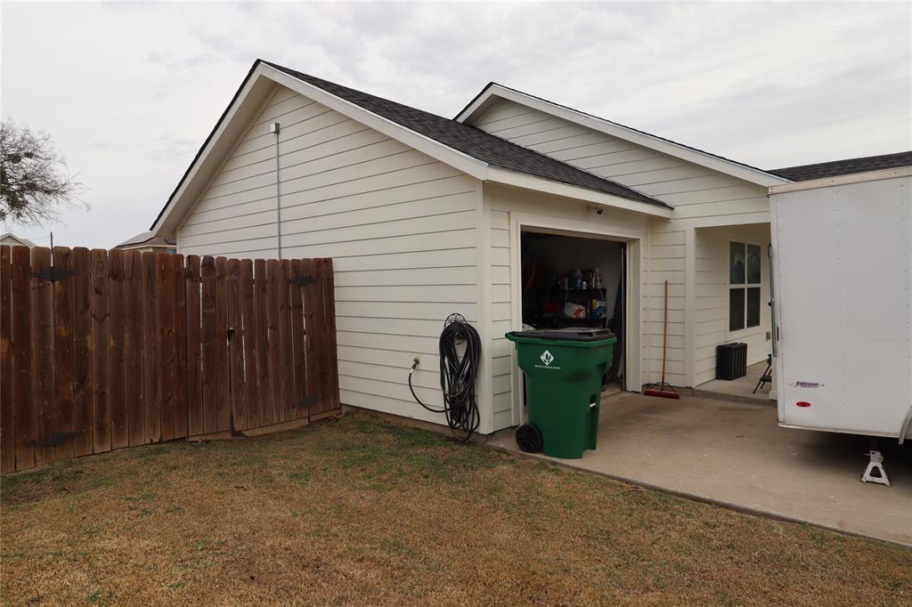 309 Thomas Street Terrell, TX 75160 - Photo 4 of 17 a view of a house with backyard and barbeque grill
