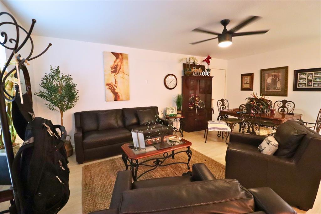 309 Thomas Street Terrell, TX 75160 - Photo 6 of 17 a living room with furniture and a clock