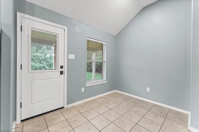 a view of an empty room and window