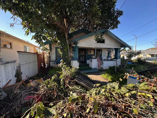 a view of a house with yard porch and furniture