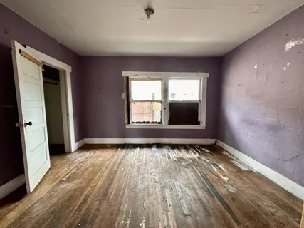 a view of an empty room and window