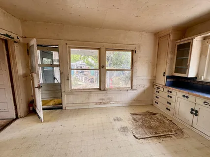a bathroom with a tub sink and a window