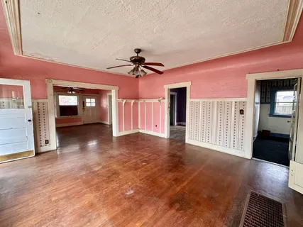 a view of livingroom with hardwood floor and a ceiling fan