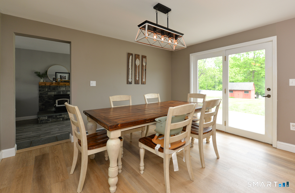 109 Harrison Lane Bethlehem, CT 06751 - Photo 9 of 28 a view of a dining room with furniture window and wooden floor