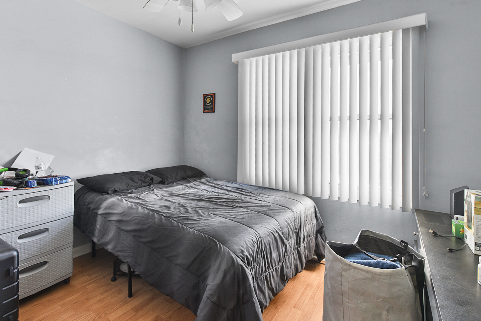 12746 South Kenneth Avenue, Unit 2F Alsip, IL 60803 - Photo 11 of 14 a bedroom with a bed and a chandelier