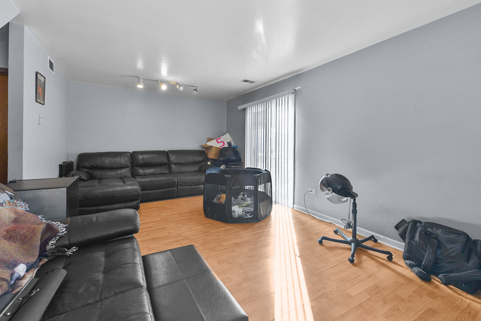12746 South Kenneth Avenue, Unit 2F Alsip, IL 60803 - Photo 5 of 14 a black leather couch sitting in a living room with furniture