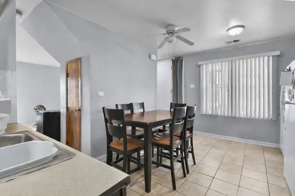 a kitchen with granite countertop a stove top oven microwave and cabinets