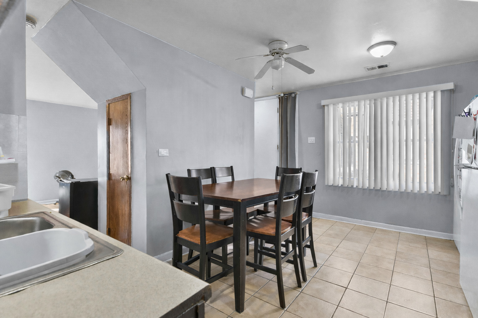 12746 South Kenneth Avenue, Unit 2F Alsip, IL 60803 - Photo 7 of 14 a view of a dining room with furniture and window