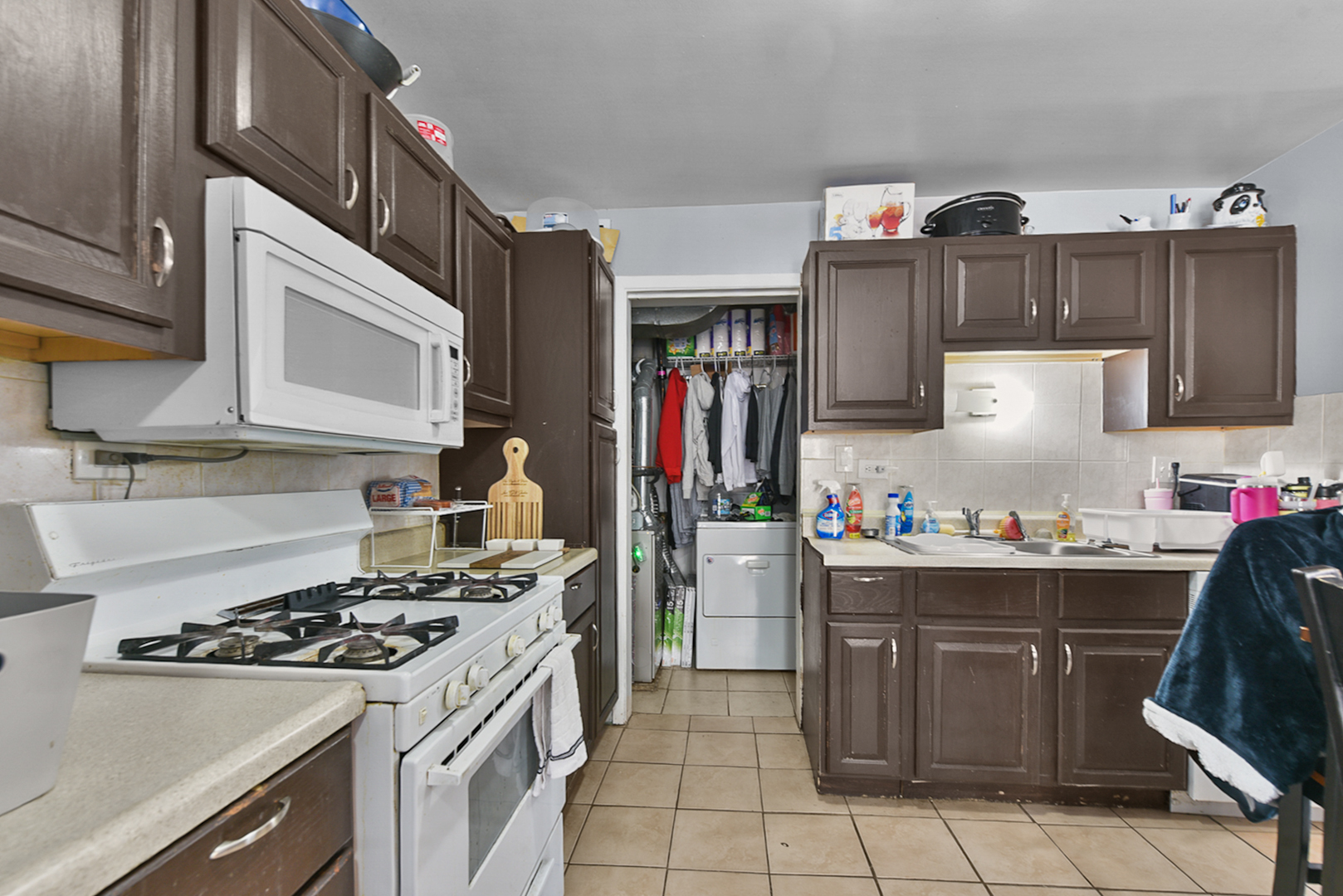 12746 South Kenneth Avenue, Unit 2F Alsip, IL 60803 - Photo 8 of 14 a kitchen with granite countertop a stove top oven microwave and cabinets