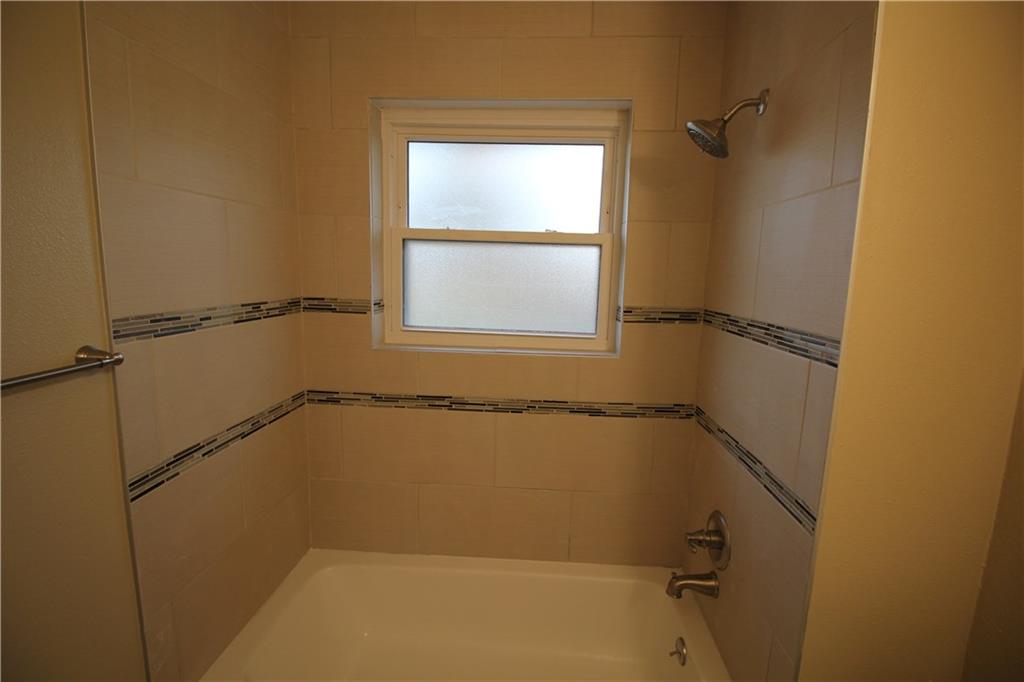 3532 Antilles Drive Mesquite, TX 75150 - Photo 15 of 18 a bathroom with a window and a shower
