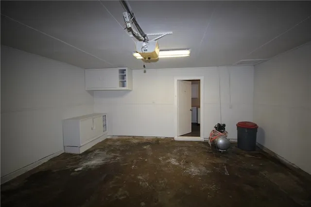 a view of room with stairs and wooden floor
