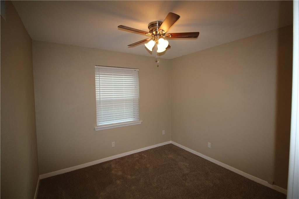 3532 Antilles Drive Mesquite, TX 75150 - Photo 10 of 18 an empty room with a window and a fan