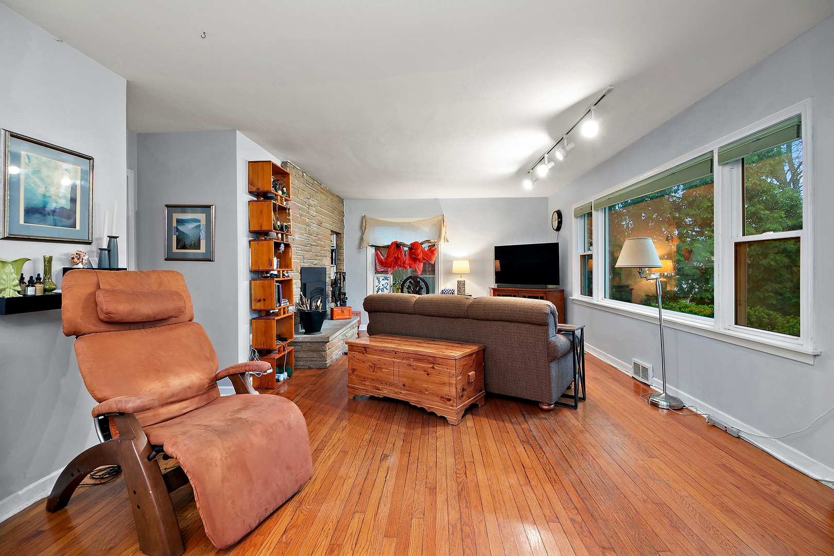 2444 183rd Street Homewood, IL 60430 - Photo 5 of 25 a living room with furniture and a flat screen tv
