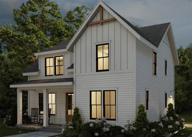 a view of a house with brick walls and flower plants