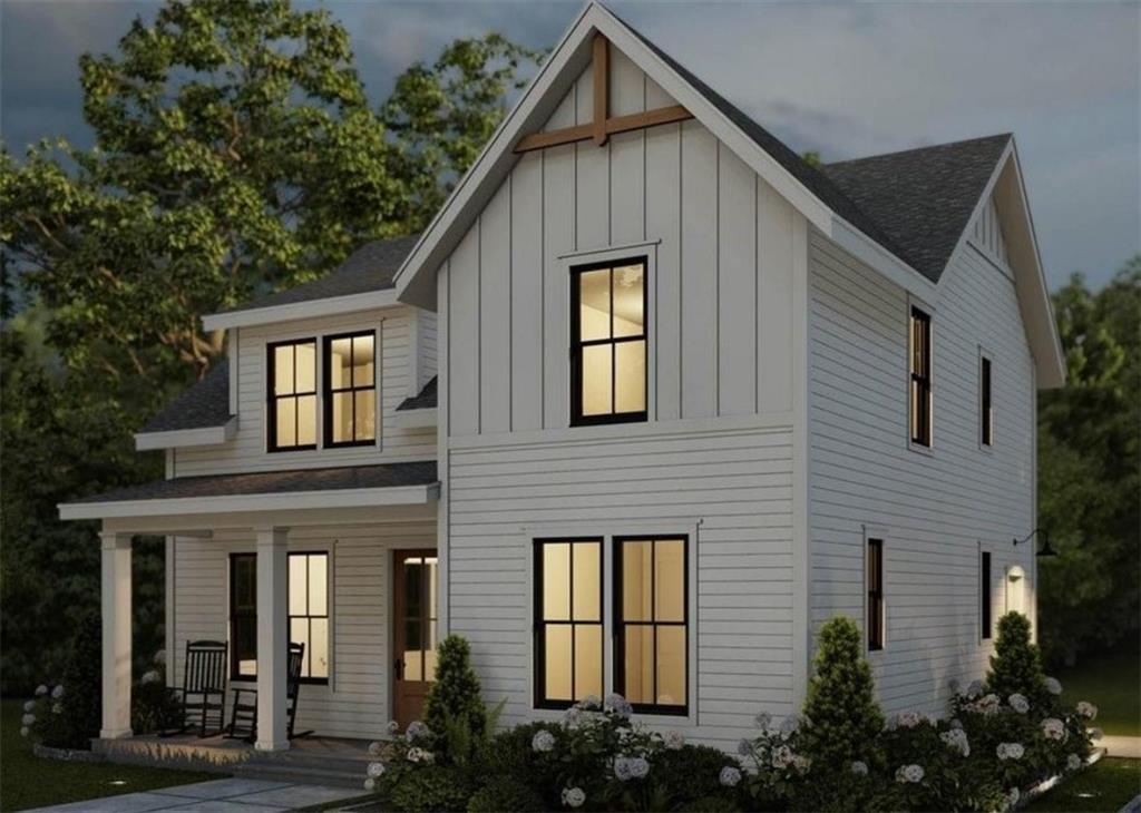 a view of a house with brick walls and flower plants