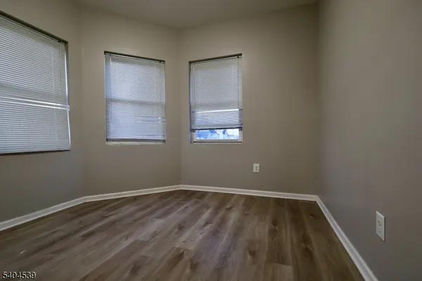 wooden floor and window in an empty room