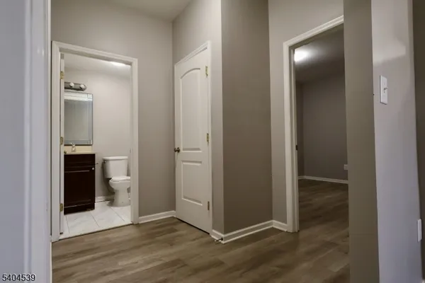 a bathroom with a toilet a sink and bathtub