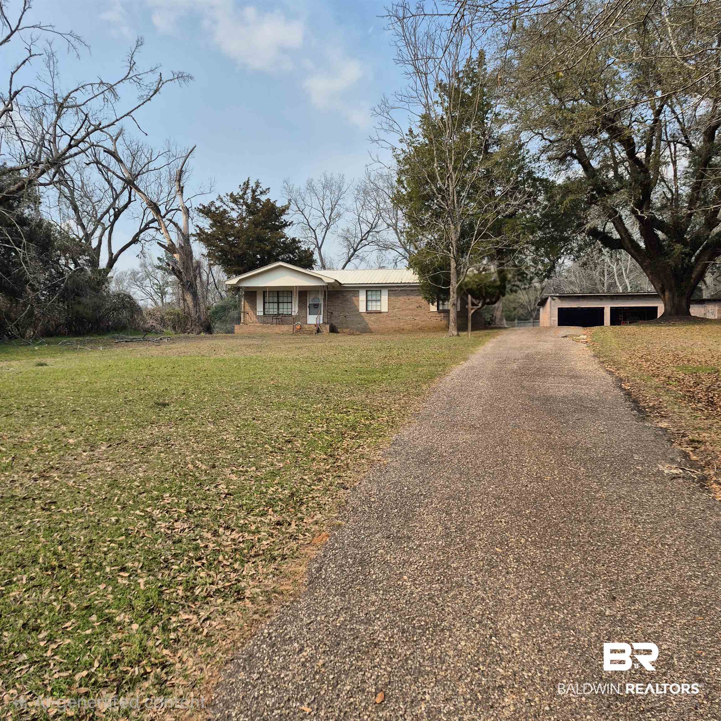 721 Perryman Street Evergreen, AL 36401 - Photo 2 of 26 Single story home featuring a front lawn and driveway