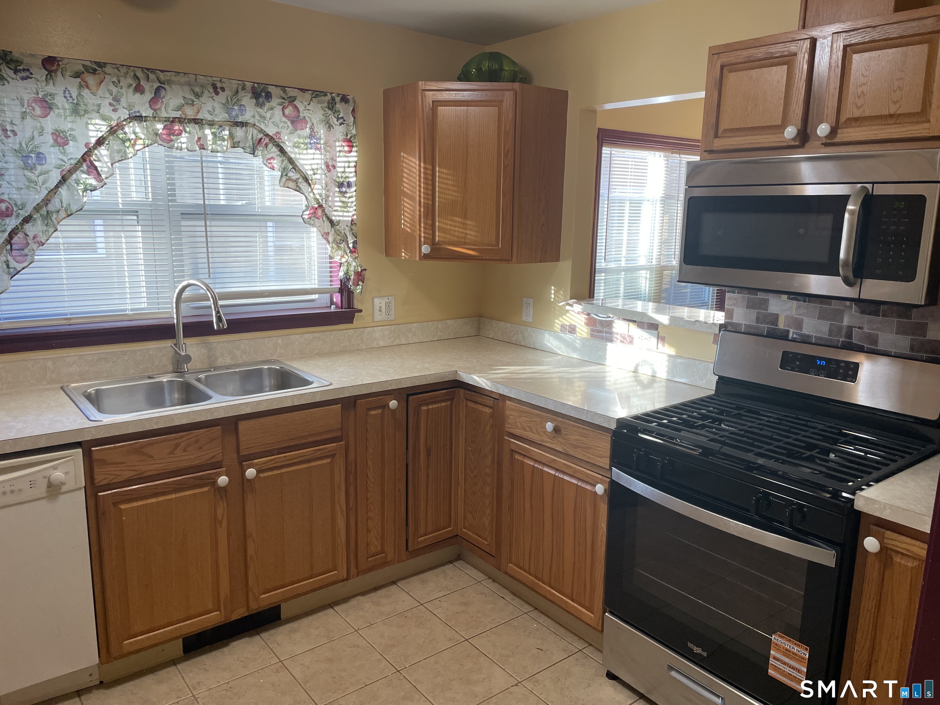 11 Button Street New Haven, CT 06519 - Photo 6 of 18 a kitchen with granite countertop a sink and a stove