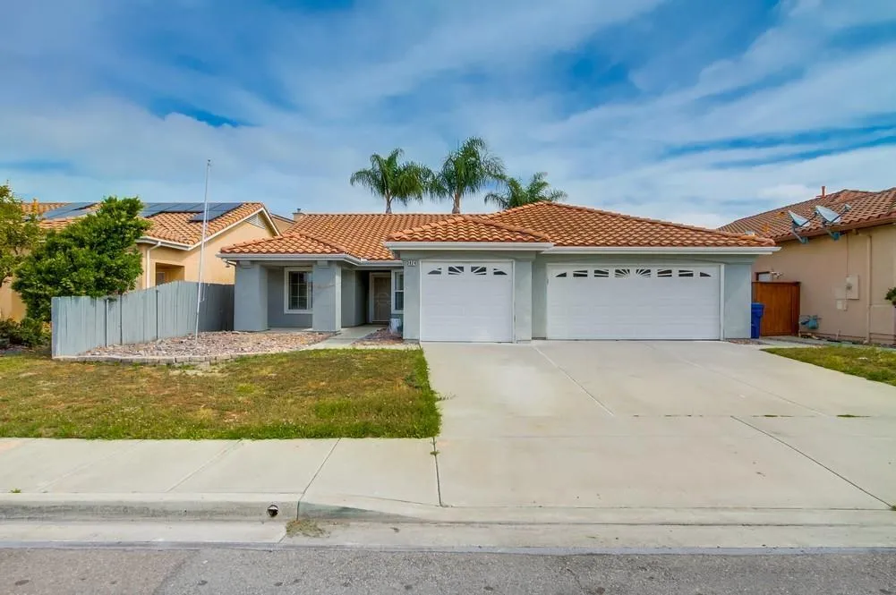 a front view of a house with a garage