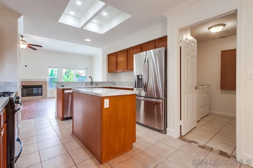 3924 Tortuga Cove Oceanside, CA 92058 - Photo 14 of 42 a kitchen with stainless steel appliances granite countertop a refrigerator and a sink