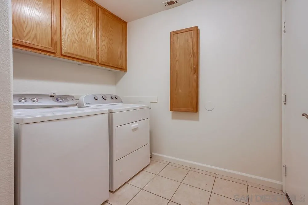 3924 Tortuga Cove Oceanside, CA 92058 - Photo 15 of 42 a utility room with dryer and washer