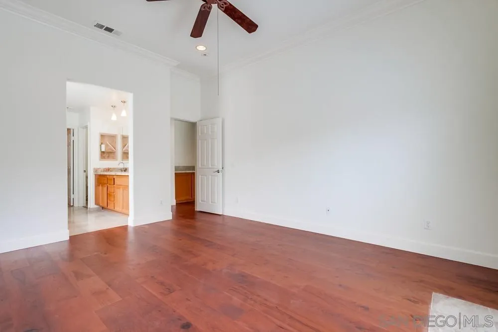 3924 Tortuga Cove Oceanside, CA 92058 - Photo 19 of 42 an empty room with a empty space and windows