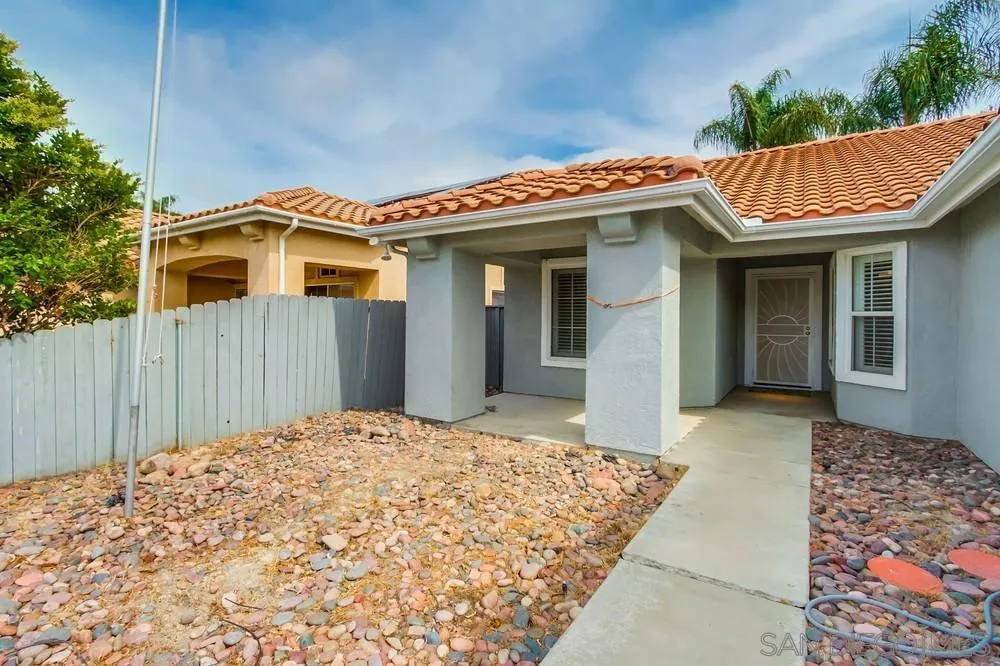 3924 Tortuga Cove Oceanside, CA 92058 - Photo 2 of 42 a front view of a house with a balcony