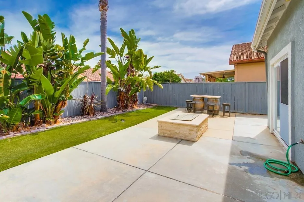 3924 Tortuga Cove Oceanside, CA 92058 - Photo 40 of 42 a view of a backyard with couches and a fire pit