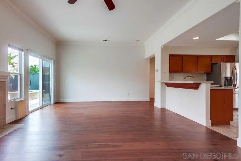 3924 Tortuga Cove Oceanside, CA 92058 - Photo 5 of 42 a view of kitchen with stainless steel appliances wooden floor and a window