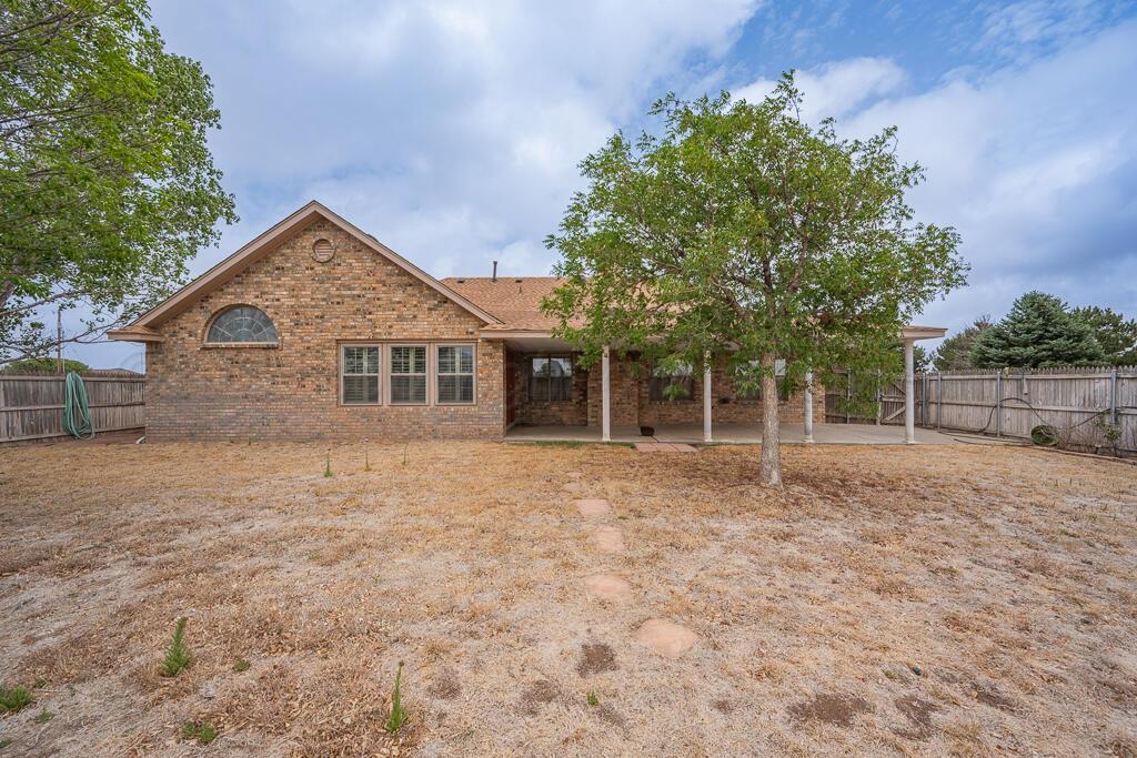 19933 Indian Spring Trail Bushland, TX 79124 - Photo 30 of 32 a front view of a house with a garden