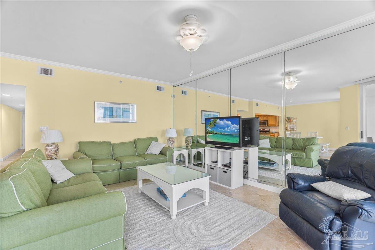 16284 Perdido Key Drive, Unit 112 Perdido Key, FL 32507 - Photo 16 of 37 a living room with furniture and a flat screen tv