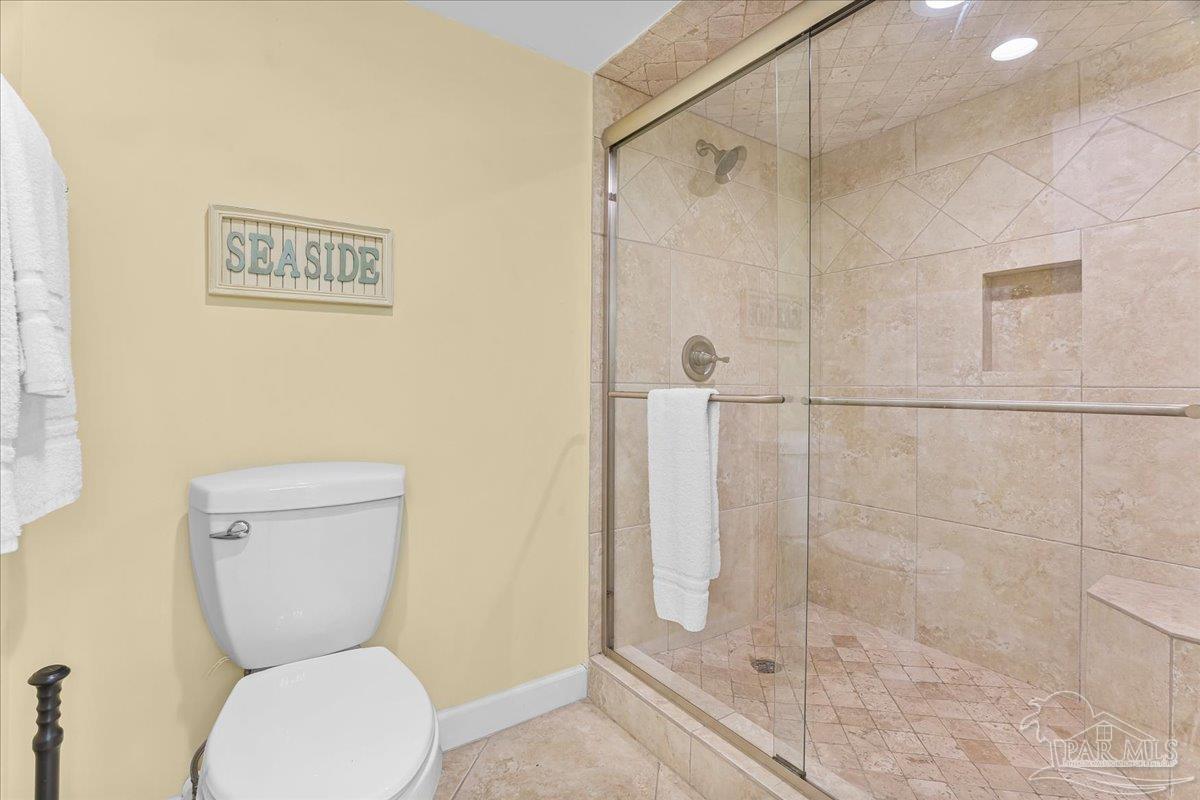 16284 Perdido Key Drive, Unit 112 Perdido Key, FL 32507 - Photo 28 of 37 a bathroom with a toilet and a shower