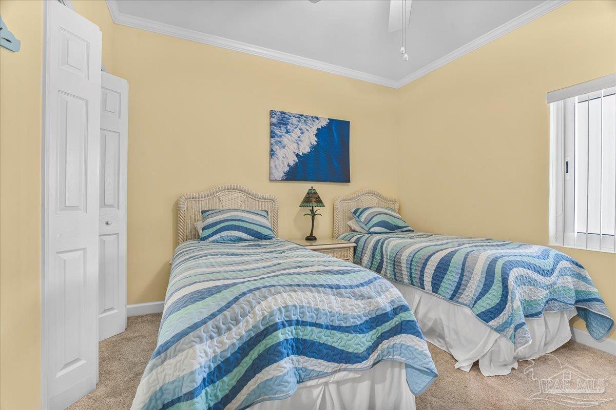16284 Perdido Key Drive, Unit 112 Perdido Key, FL 32507 - Photo 31 of 37 a bedroom with two beds and painting on the wall