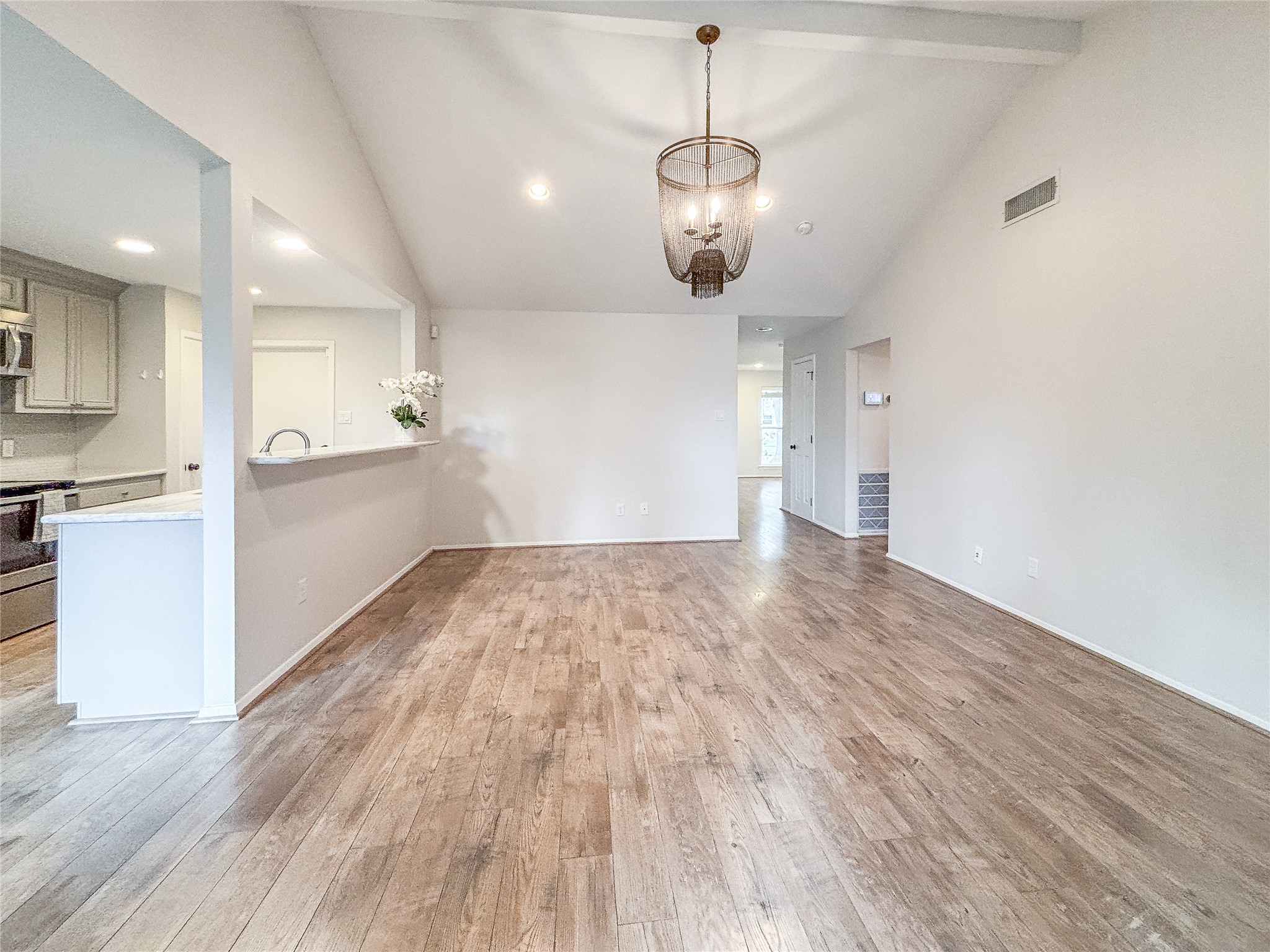3123 Lazy Spring Drive Houston, TX 77080 - Photo 11 of 24 an empty room with wooden floor and windows