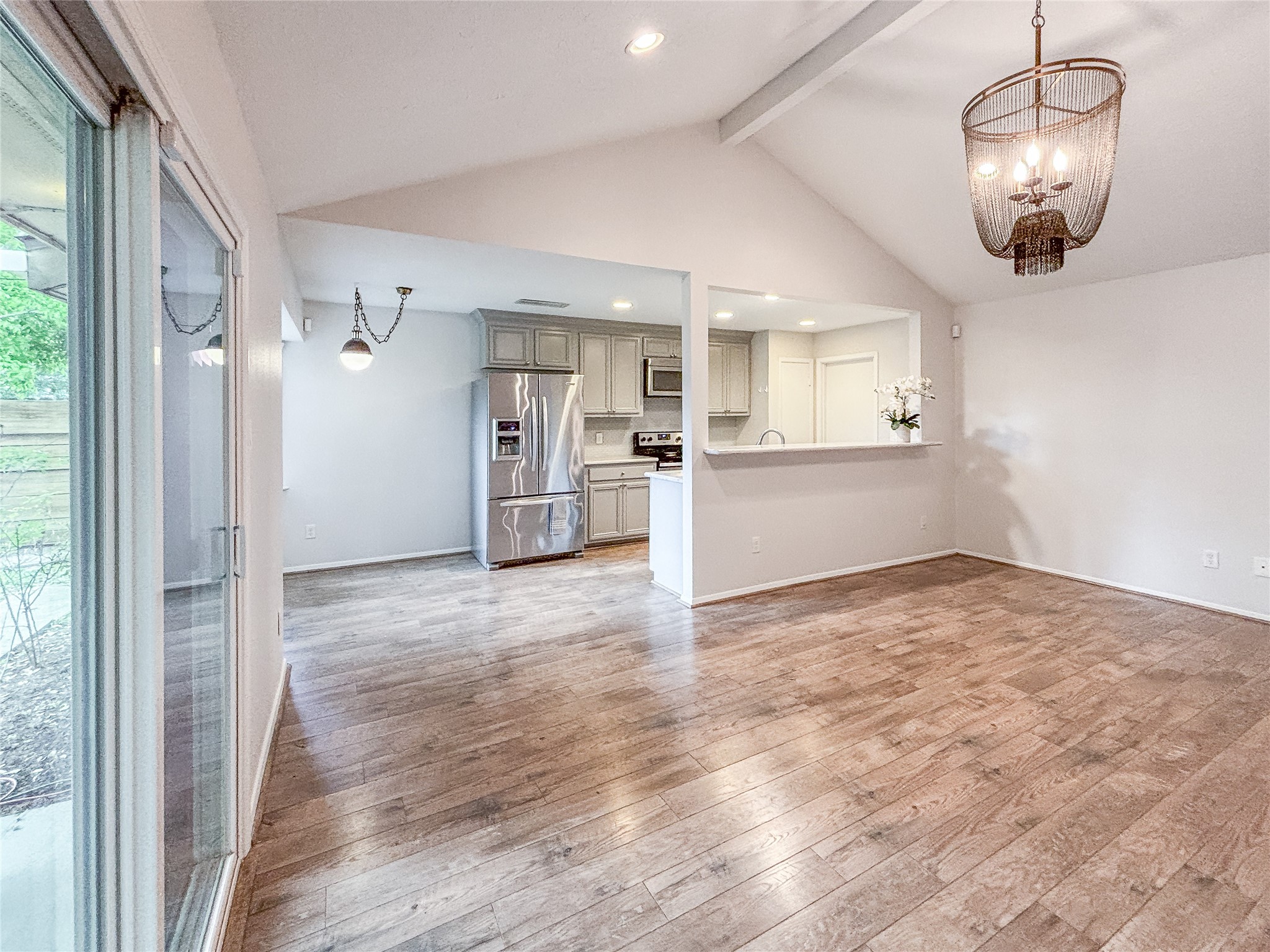 3123 Lazy Spring Drive Houston, TX 77080 - Photo 12 of 24 a view of a kitchen with a sink and dishwasher wooden floor