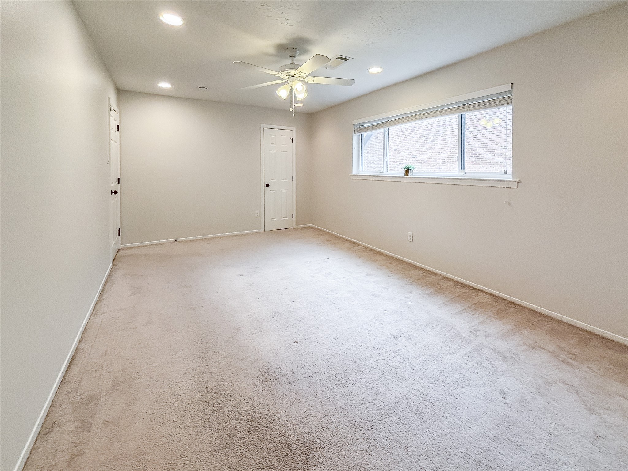 3123 Lazy Spring Drive Houston, TX 77080 - Photo 14 of 24 wooden floor in an empty room with a window