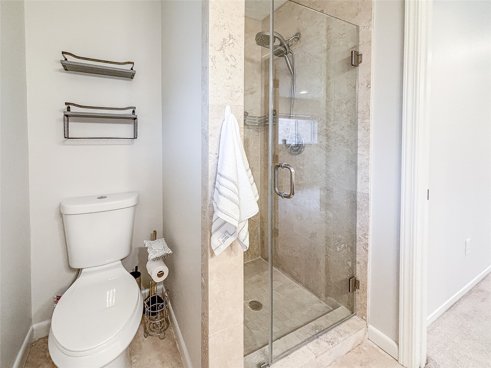 3123 Lazy Spring Drive Houston, TX 77080 - Photo 16 of 24 a white toilet next to a bathroom