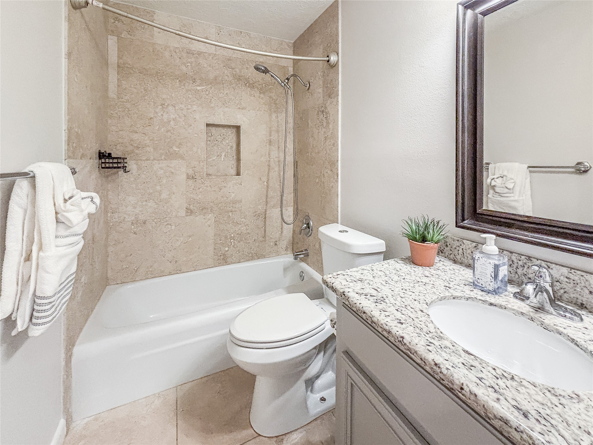 3123 Lazy Spring Drive Houston, TX 77080 - Photo 20 of 24 a bathroom with a granite countertop sink toilet and shower