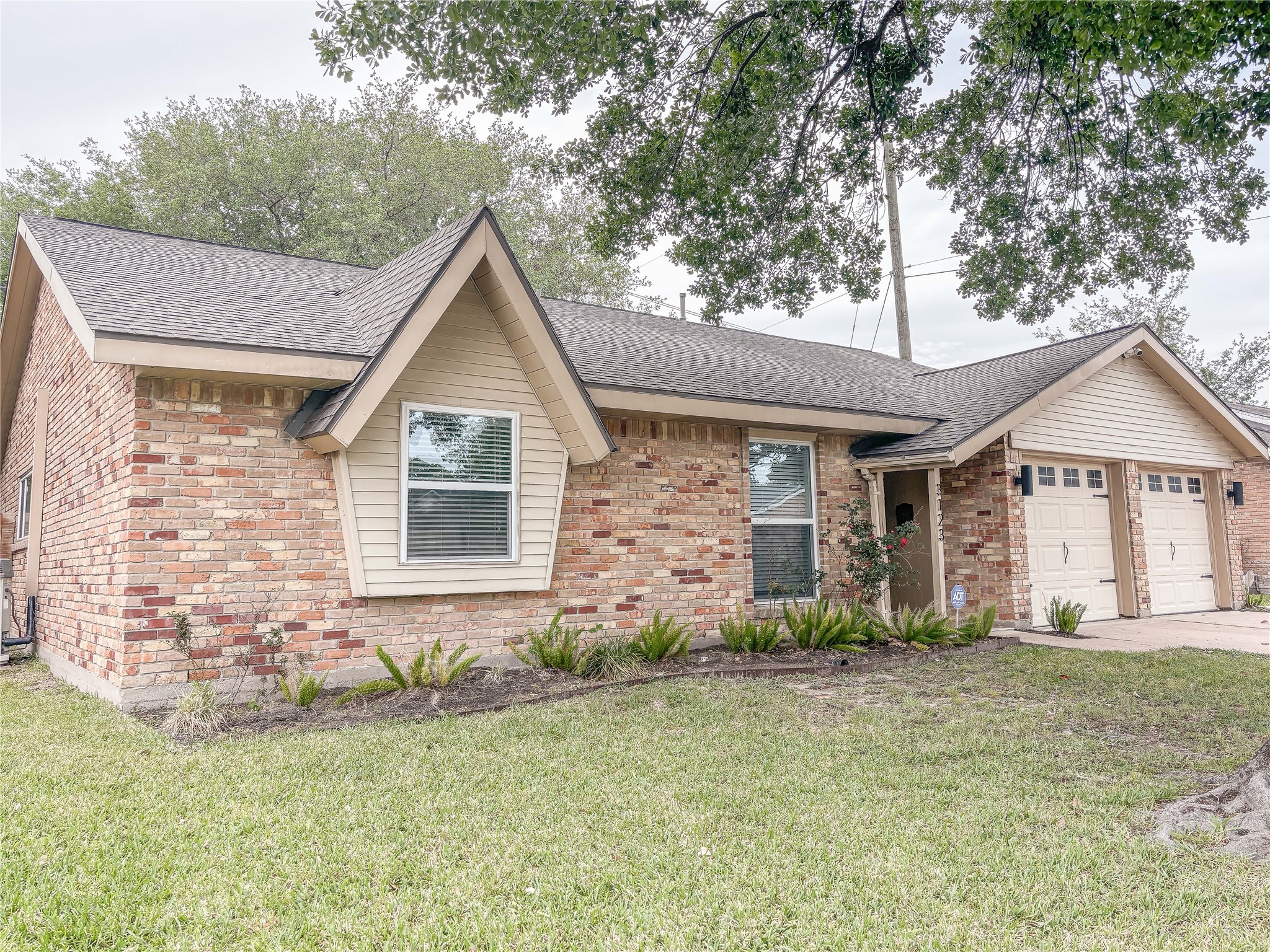 3123 Lazy Spring Drive Houston, TX 77080 - Photo 24 of 24 a front view of a house with garden