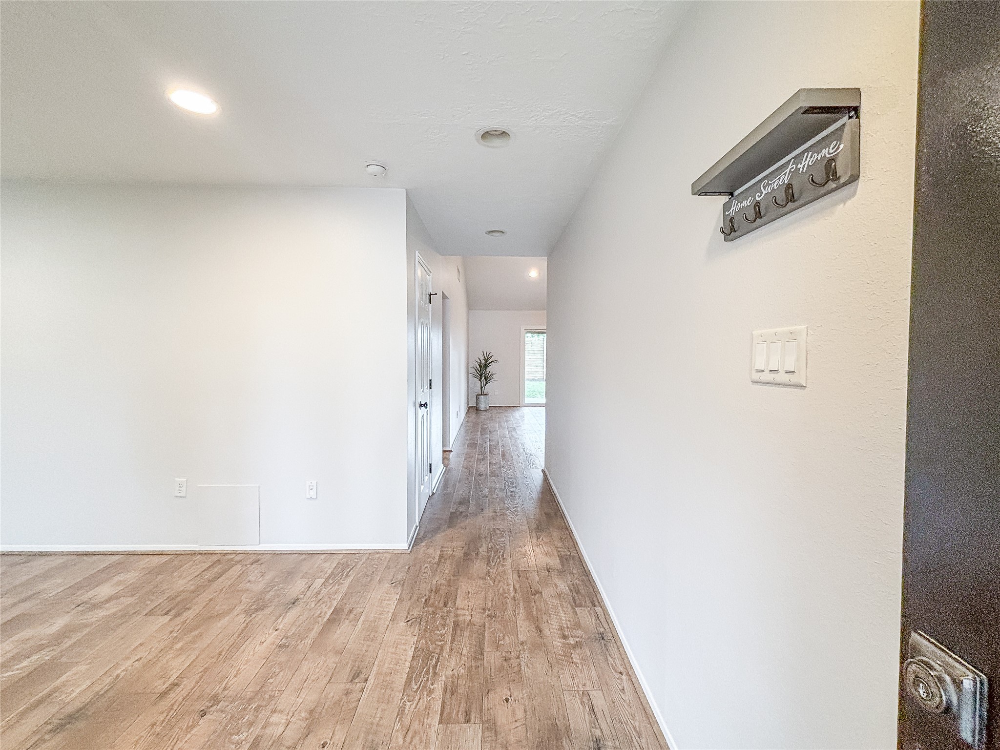 3123 Lazy Spring Drive Houston, TX 77080 - Photo 3 of 24 a view of a hallway with wooden floor