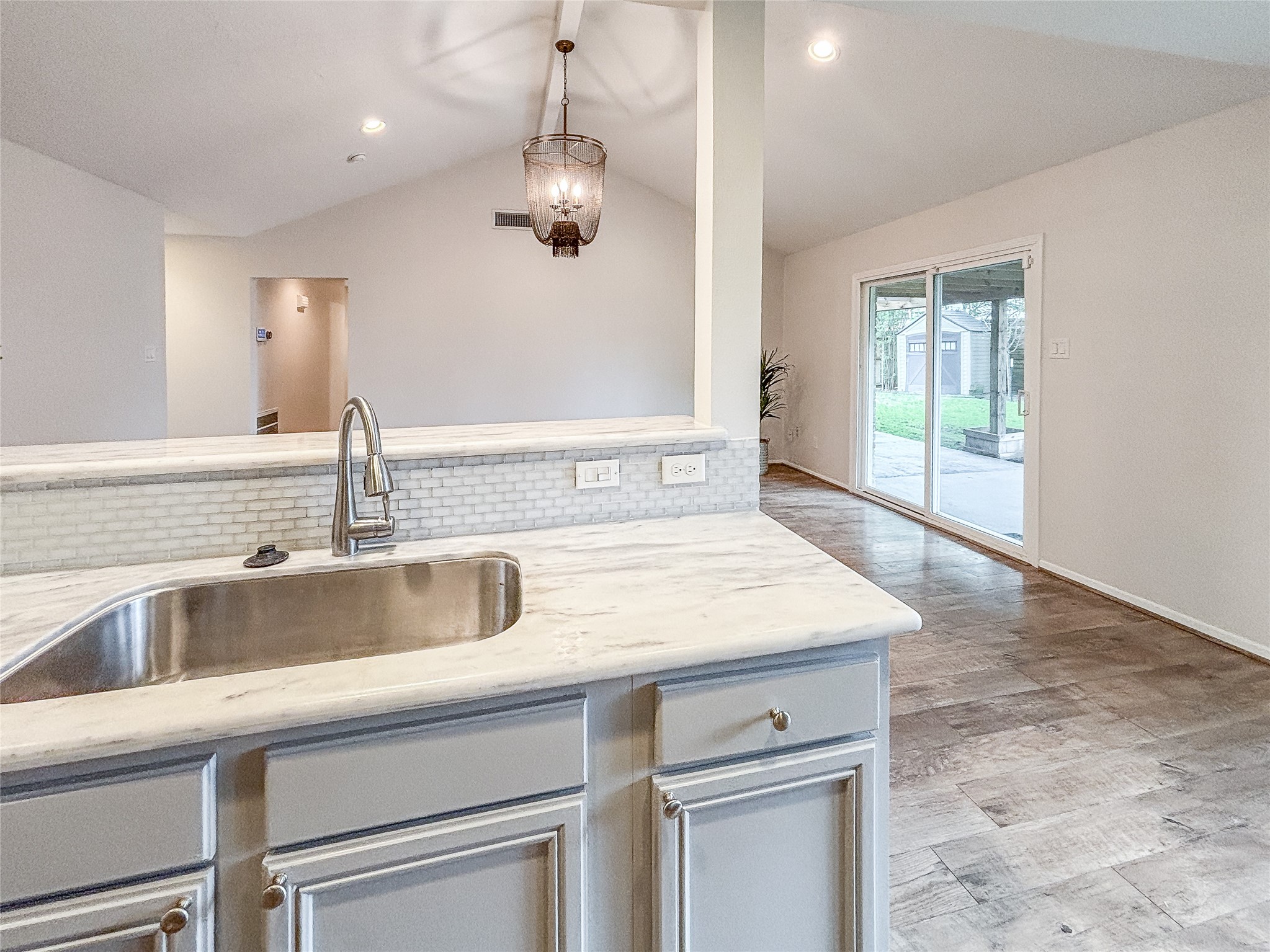 3123 Lazy Spring Drive Houston, TX 77080 - Photo 10 of 24 a kitchen with a sink and a refrigerator