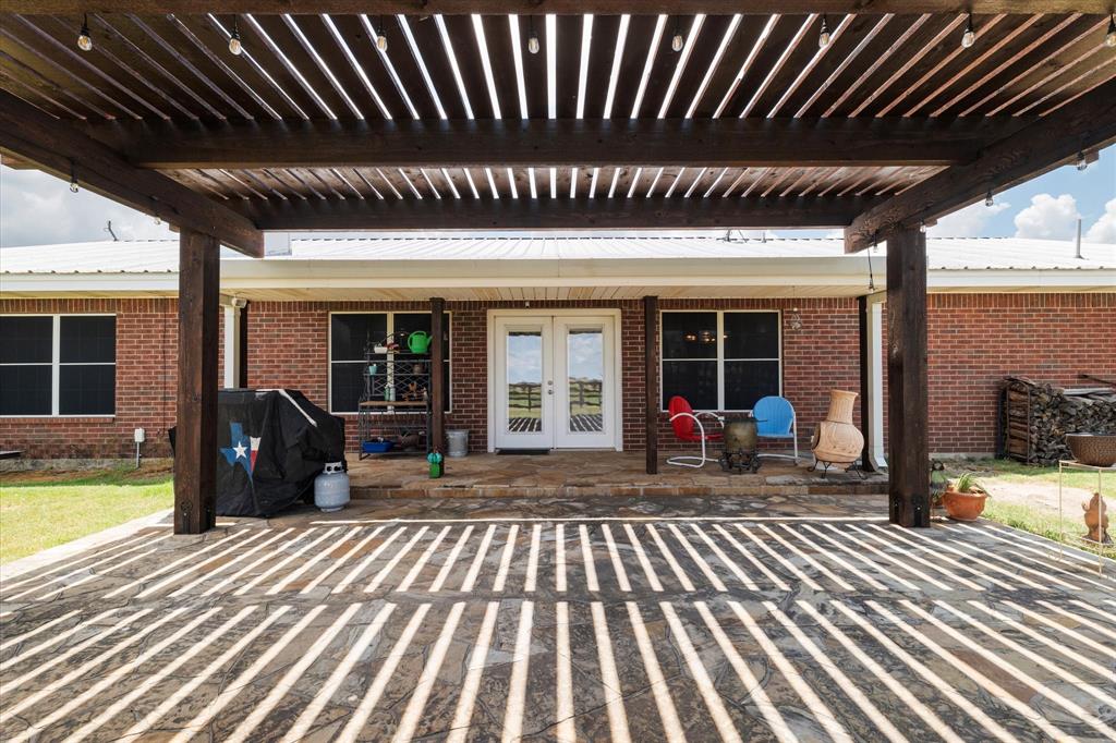 20175 Willow Glade Circle Pilot Point, TX 76258 - Photo 24 of 32 View of patio / terrace featuring a grill and french doors