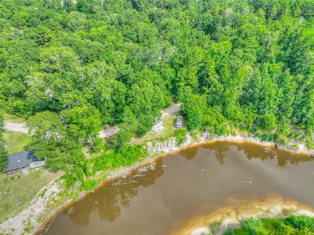 a view of a garden with a wooden fence